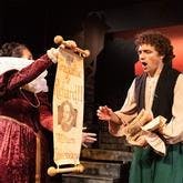 Production of Something Rotten featuring Nick Bottom gasping at scroll showing Shakespeare is producing Richard III